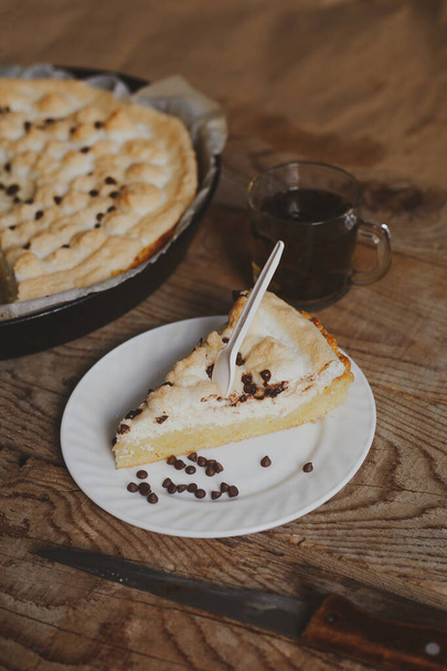 Freshly baked cheesecake on a wooden background. View from directly from above - Photo, Image