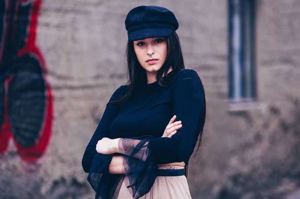 Fashion Portrait of Stylish Pretty Brunette. Young Woman Outdoor. Cool hipster student woman. Trendy hipster Russian teenage girl wearing wearing casual clothes. City lifestyle stylish hipster girl. Trendy outfit - Photo, Image