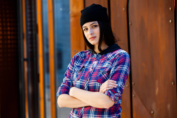 Fashion Portrait of Stylish Pretty Brunette. Young Woman Outdoor. Cool hipster student woman. Trendy hipster Russian teenage girl wearing wearing casual clothes. City lifestyle stylish hipster girl. Trendy outfit - Zdjęcie, obraz