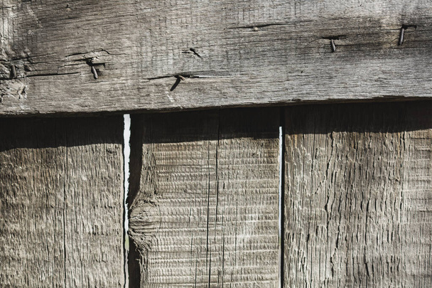古いグレーの木製のフェンスの木のテクスチャ - 写真・画像