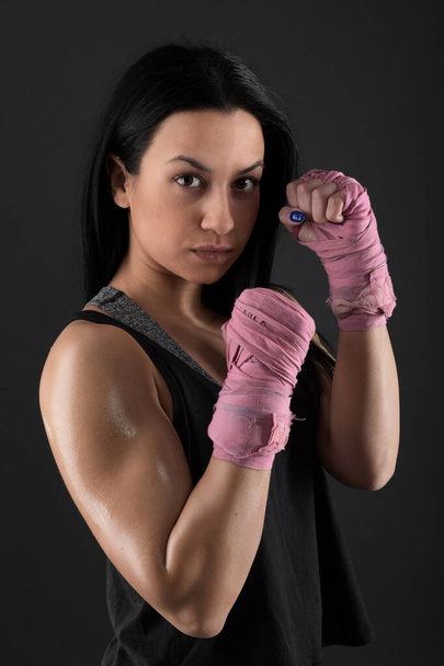 sexy girl training in the gym engaged in boxing - Foto, imagen