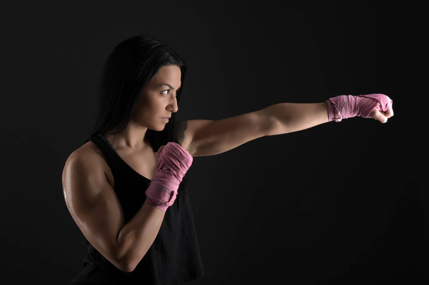 sexy girl training in the gym engaged in boxing - Photo, Image