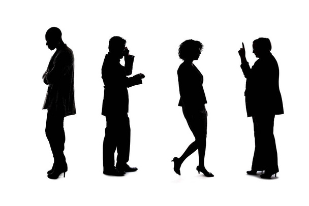 Silhouette di un gruppo di lavoratori che rappresentano un'azienda o un evento di networking. Gli uomini d'affari e le donne d'affari sono irriconoscibili e anonimi e rappresentano una squadra o uno staff di uffici.
. - Foto, immagini