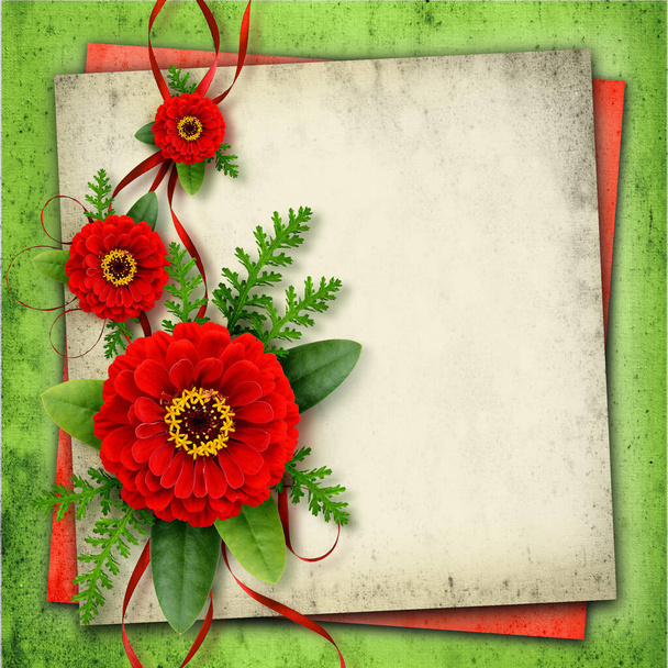 Arrangement with red zinnia flowers and silk ribbons on old paper background - Fotó, kép