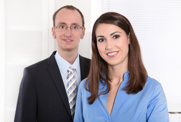 Business teamwork - man and woman on white with blue - Φωτογραφία, εικόνα