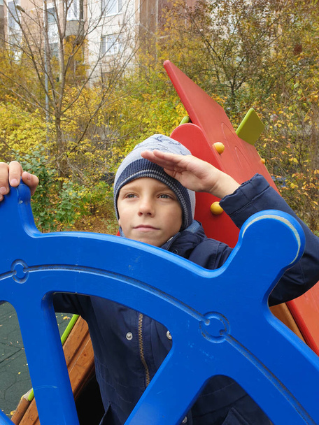 boy playing captain of ship in playground outdoor - Zdjęcie, obraz