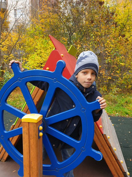 boy playing captain of ship in playground outdoor - Zdjęcie, obraz