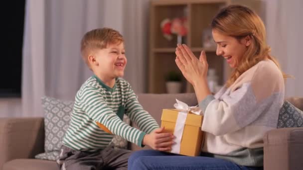 little son giving present to mother at home - Footage, Video