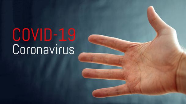 Epidemia de coronavírus, palavra COVID-19 em segundo plano com a mão, surto de COVID-19 e fundo de influenza coronavírus. Risco médico pandémico, imunologia, virologia, conceito de epidemiologia
 - Foto, Imagem