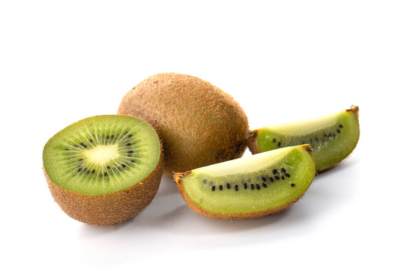 Kiwi fruit with pieces isolated on a white background, close -up. - Fotoğraf, Görsel