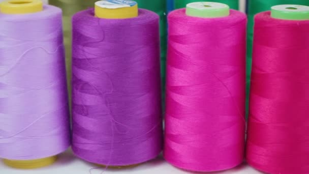 Shooting of pink spools of threads in workshop - Footage, Video