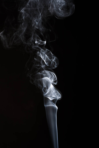 Abstract smoke on black background for designs. - Фото, изображение