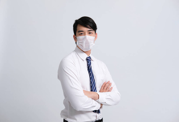 businessman man wearing protective mask against cold flu covid 19 virus bacteria infection pollution - Zdjęcie, obraz