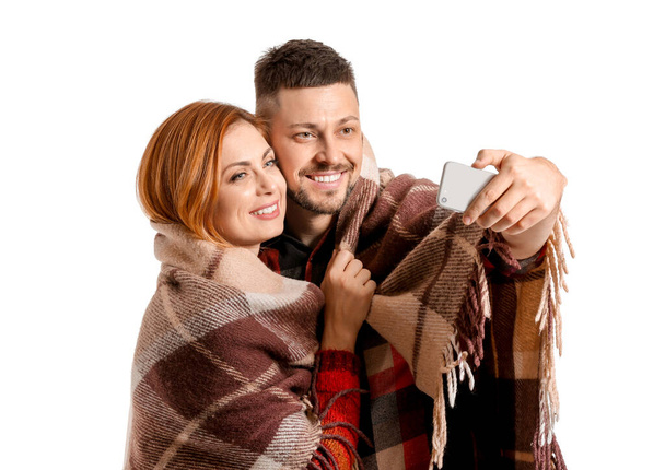 Couple taking selfie on white background - Photo, Image