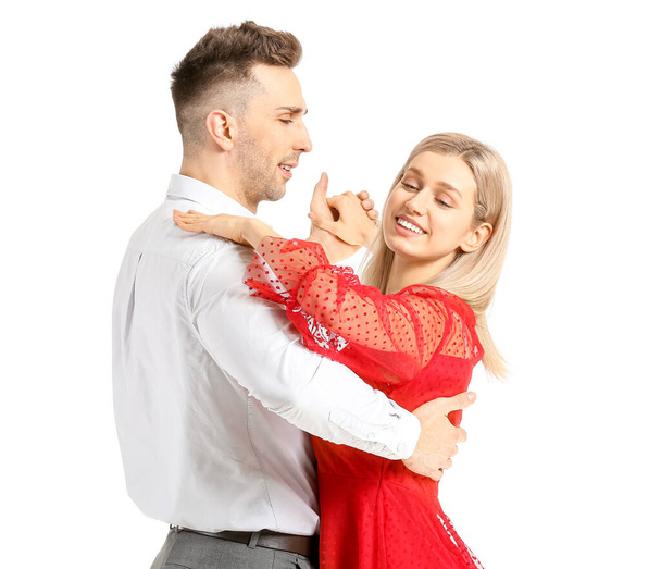 Happy dancing young couple on white background - Photo, Image