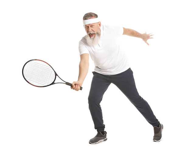 Elderly tennis player on white background - 写真・画像