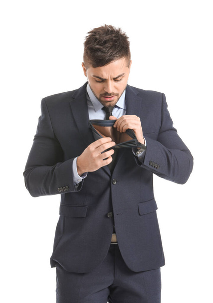 Сумний бізнесмен з порожнім гаманцем на білому тлі
 - Фото, зображення