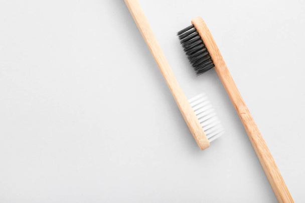 Tooth brushes on light background - Foto, afbeelding