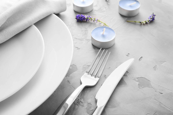Beautiful table setting with floral decor, closeup - Fotó, kép