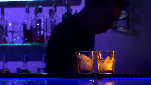 bartender is making cocktail at bar counter in - Footage, Video