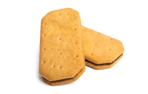 doppelte quadratische Kekse mit Schokolade auf weißem Hintergrund - Foto, Bild