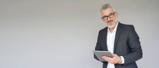 Businessman using digital tablet isolated on background- template - Foto, Imagem