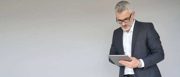 Businessman using digital tablet isolated on background- template - Fotografie, Obrázek