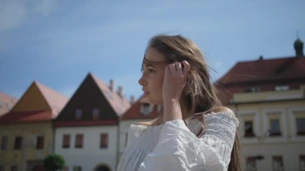 sightseeing tour of european city, woman is viewing old architecture - Materiał filmowy, wideo