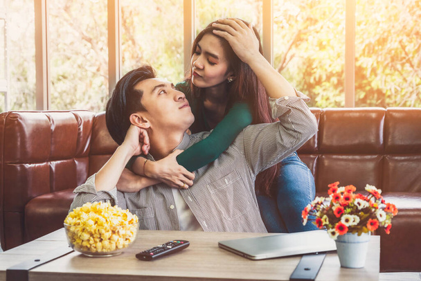 Happy Asian couple relax in living room. Love and relationship concept. - Photo, Image