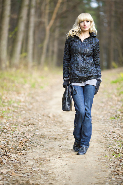Girl on walk on the autumn wood - Photo, Image