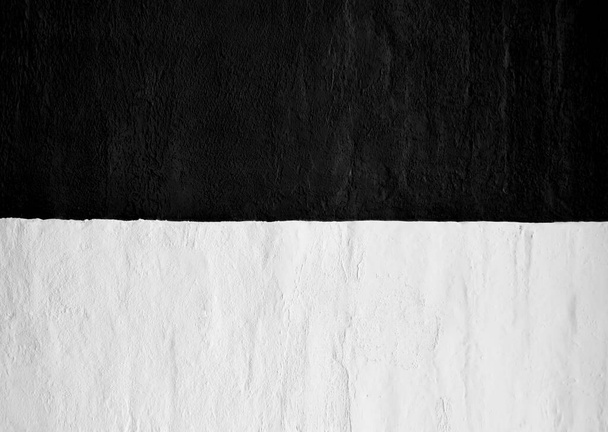 East Prussia flag on concrete wall. Patriotic  background. National flag of East Prussia. black and white flag depicted in bright paint colors on old relief plastering wall. Textured banner on rough background - Φωτογραφία, εικόνα