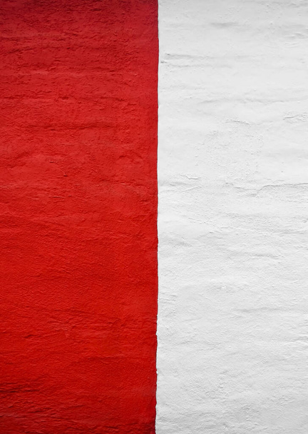 poland flag on concrete wall. Patriotic grunge background. National flag of Poland. Poland flag depicted in bright paint colors on old relief plastering wall. Textured banner on rough background - Foto, Imagen