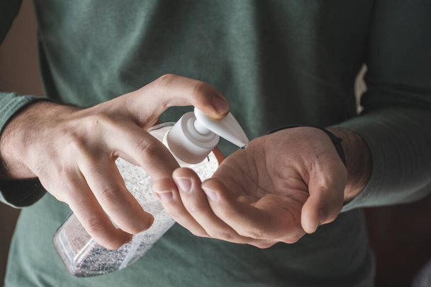 Man spreading disinfectant gel on his hands - Foto, Bild