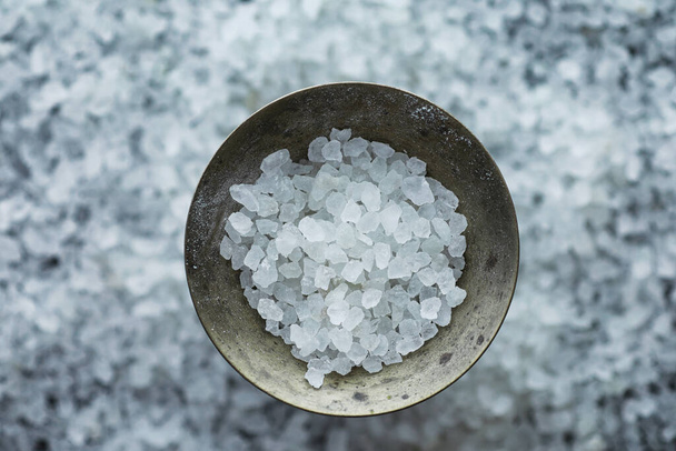 Large sea salt. Spice. Mortar and pestle for grinding salt. - Photo, Image