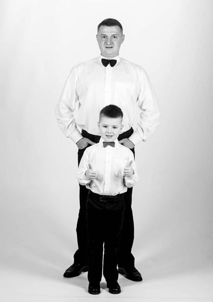 esthete. trust and values. male fashion. happy child with father. business meeting party. little boy with dad esthete businessman. family day. father and son in formal suit. tuxedo style. esthete. - Фото, изображение