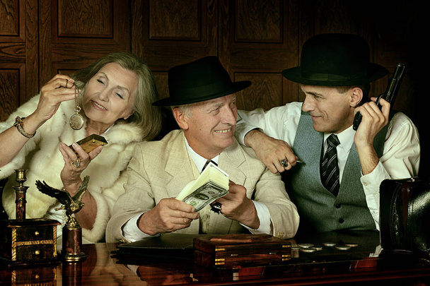 Gangsters companions on the table in retro style. - Photo, Image