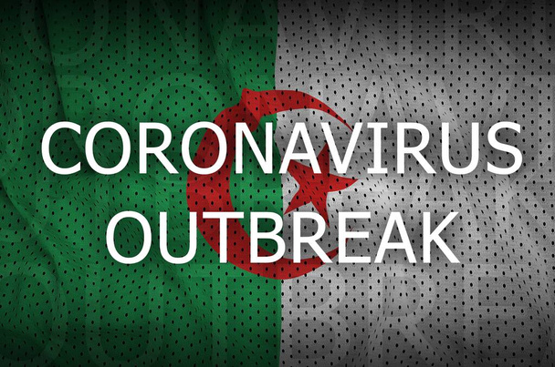 アルジェリアの国旗とコロナウイルスの流行の碑文。Covid-19または2019-ncovウイルスの概念 - 写真・画像