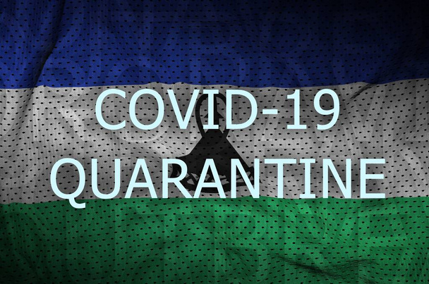 Lesotho zászló és Covid-19 karantén felirat. Coronavirus vagy 2019-ncov vírus koncepció - Fotó, kép