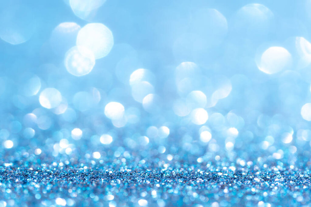Glitter, funkeln defokussiert unscharfen blauen Hintergrund mit Bokeh-Lichtern - Foto, Bild