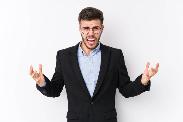 Young caucasian business man posing in a white background isolated Young caucasian business man screaming with rage. - Photo, Image