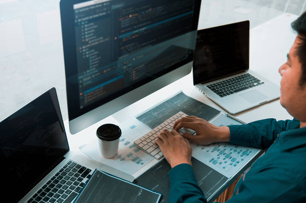 Asian man working code program programista komputerowy web development working design software on desk in office. - Zdjęcie, obraz