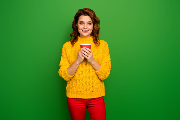 Portrait cheerful charming pretty woman enjoy her evening weekend fall free time hold cup with hot aromatic cacao cappuccino wear good look pullover isolated bright color background - 写真・画像