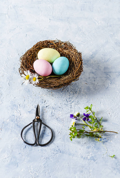 Three Easter eggs on delicate blue background - Foto, afbeelding