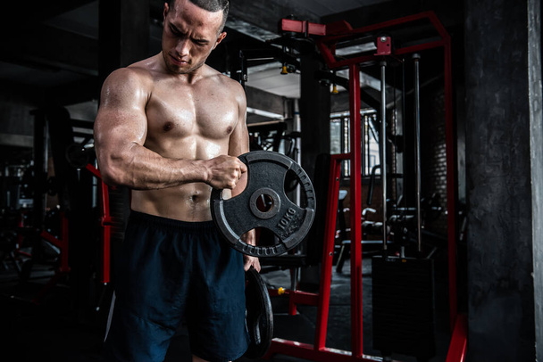 Portrait of asian man big muscle at the gym, body weight training - Zdjęcie, obraz