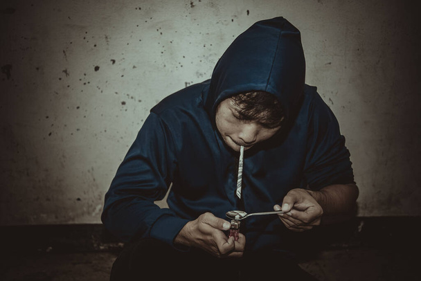 Asian man with drug addicting to injecting heroin into their veins themselves - 写真・画像