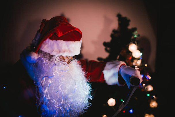 Portrait of santa clause read paper and checking list name for send gift to children - Foto, Imagem