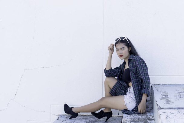 Portrait of beautiful asian woman,Hipsters girl on stair for take a picture,Thailand people - Foto, immagini