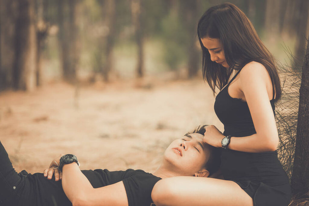 young Asian couple in love spending time together in the forest - Photo, image