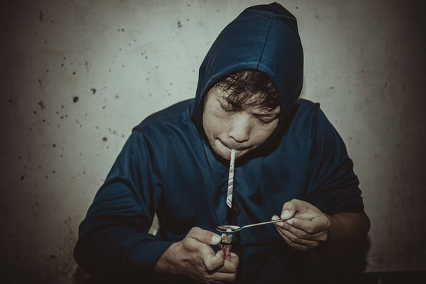 Asian man with drug addicting to injecting heroin into their veins themselves - Fotoğraf, Görsel