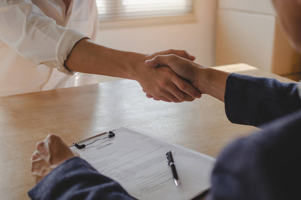 Partnership. two business people shaking hand after business signing contract in meeting room at company office, job interview, investor, success, negotiation, partnership, teamwork, financial concept - Photo, Image